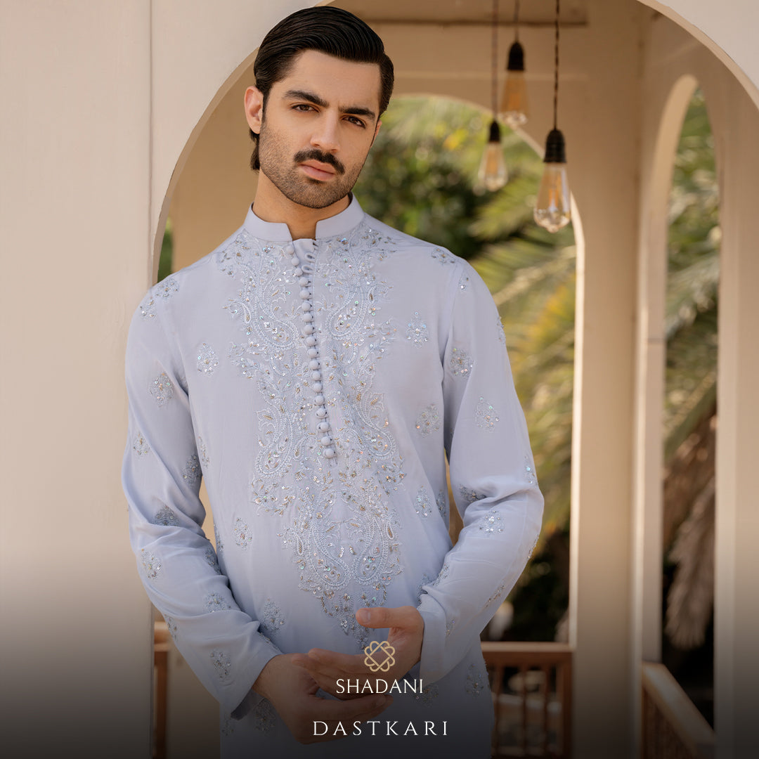 A modern kurta pajama outfit featuring a sleek embroidered kurta paired with pajama trousers, styled for a multicultural wedding in the West