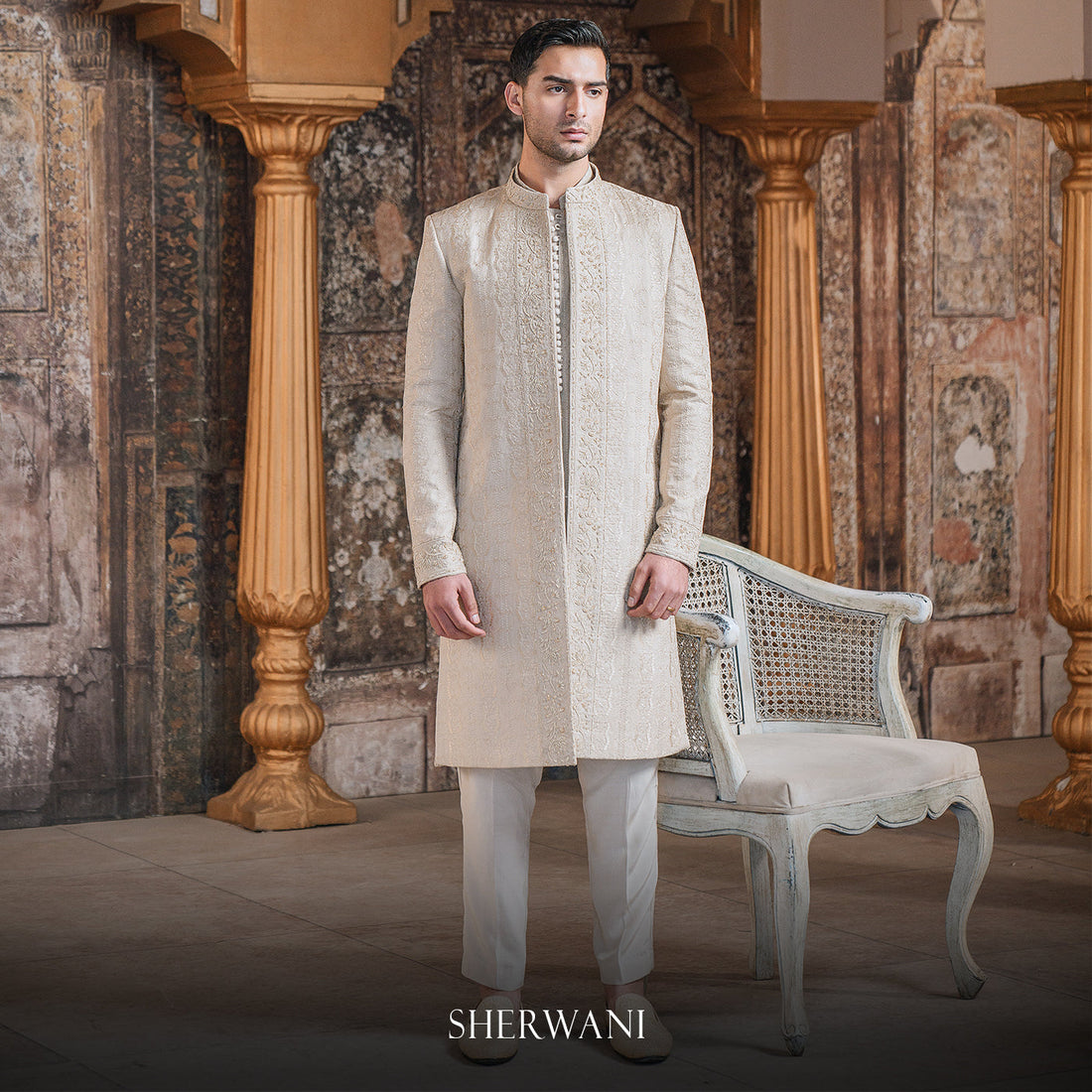 A groom in a Shadani raw silk sherwani with intricate zardozi embroidery, paired with a silk turban for a wedding ceremony.